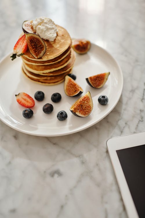 Pancakes With Berries on White Ceramic Plate