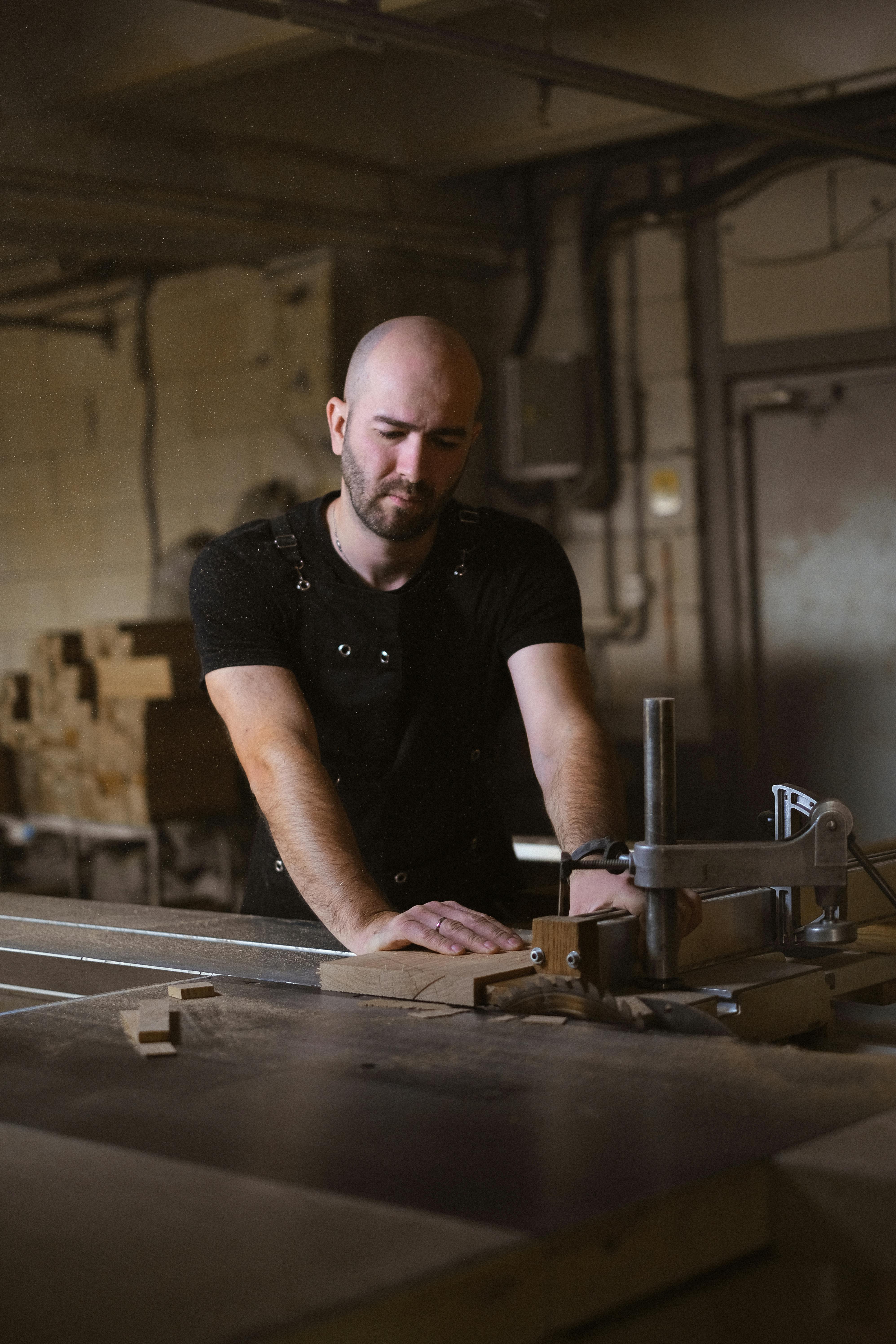 focused craftsman working at sawbench