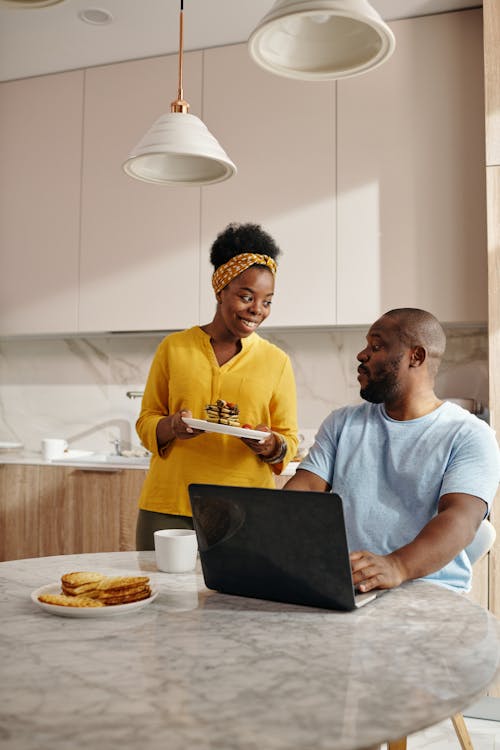 Free Woman Serving Pancakes to his Lover Stock Photo