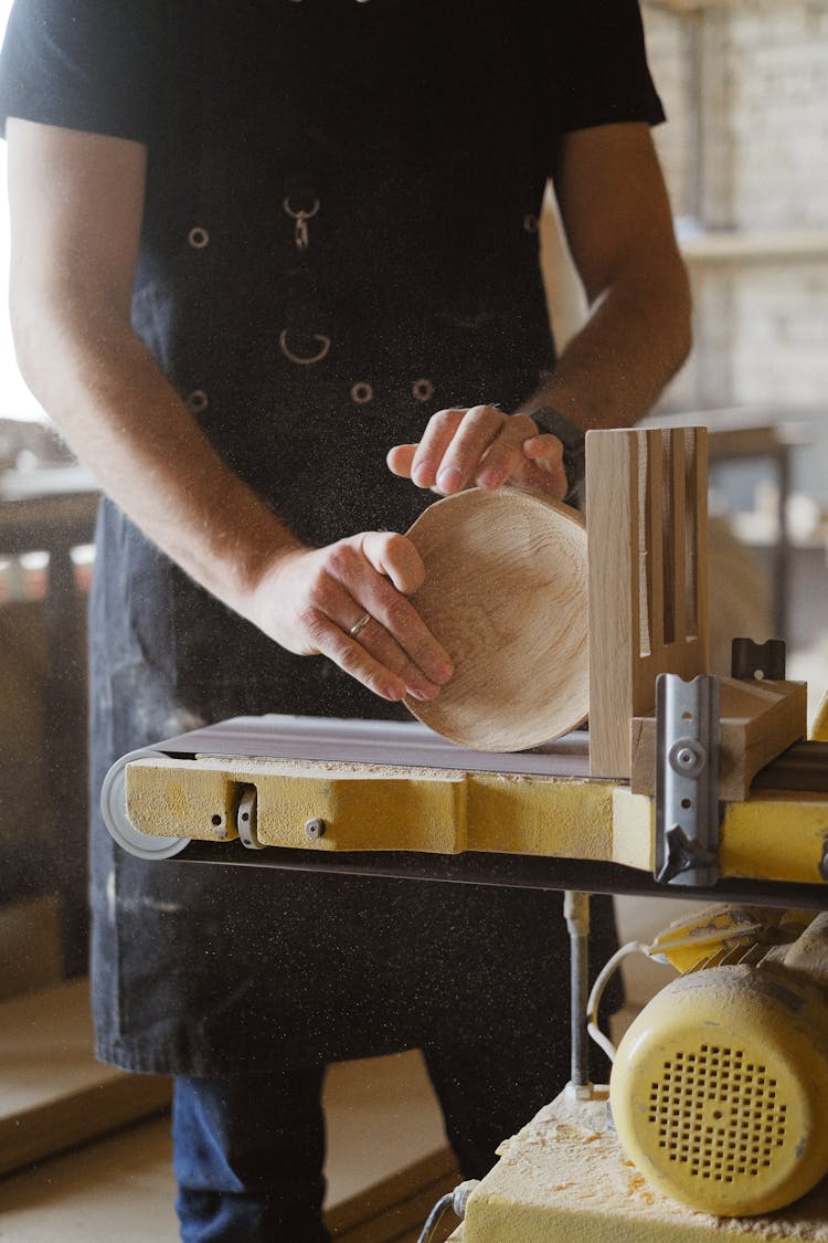 Crop Artisan Polishing Wooden Detail With Belt And Disc Sander