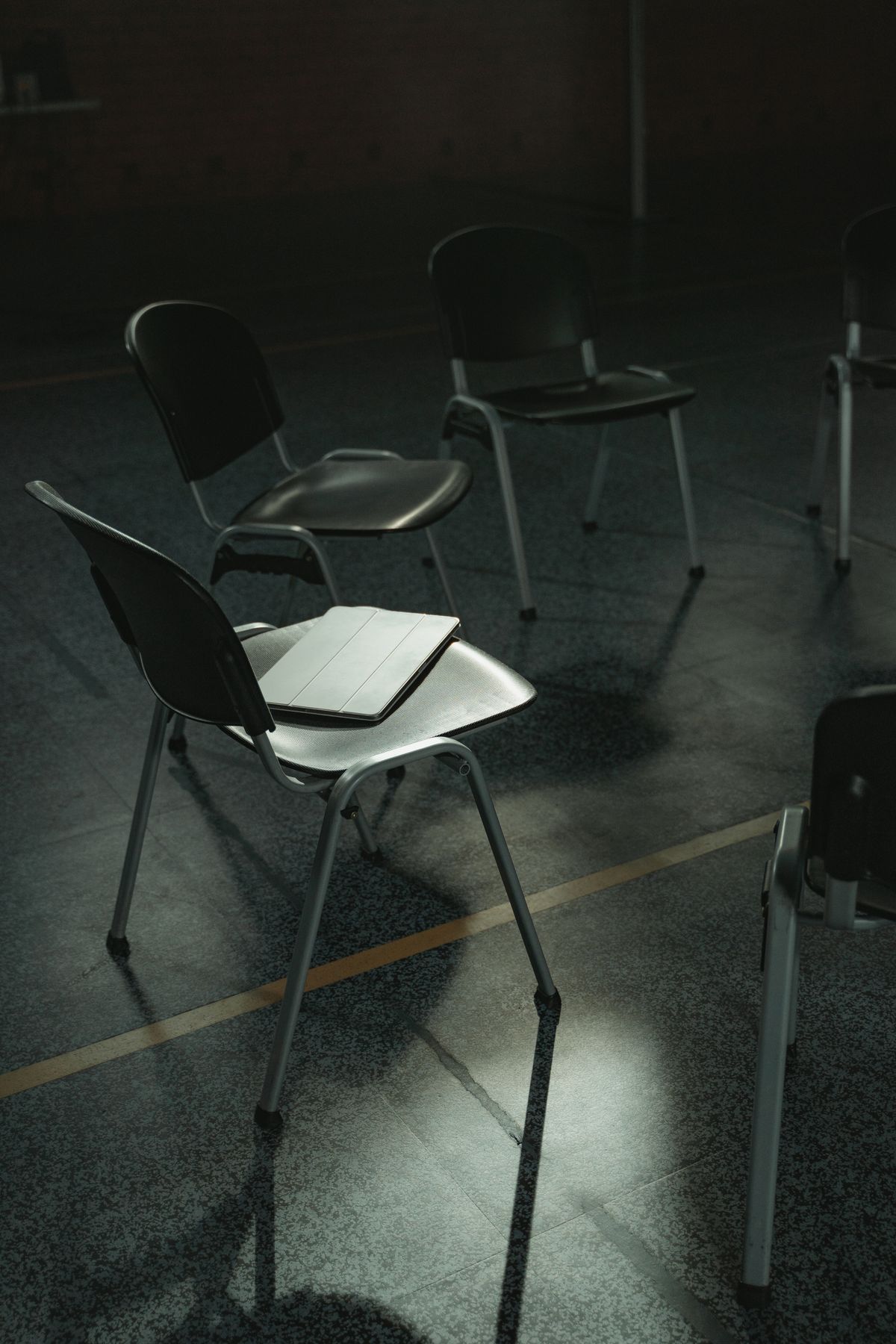 Illustrative empty chairs arranged for a supportive group conversation
