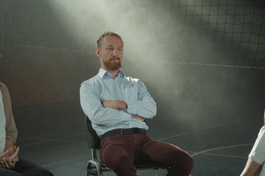 Man in White Dress Shirt Sitting on Chair
