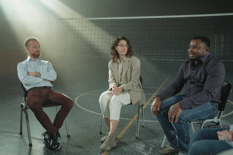 Group Of People Sitting On Chair