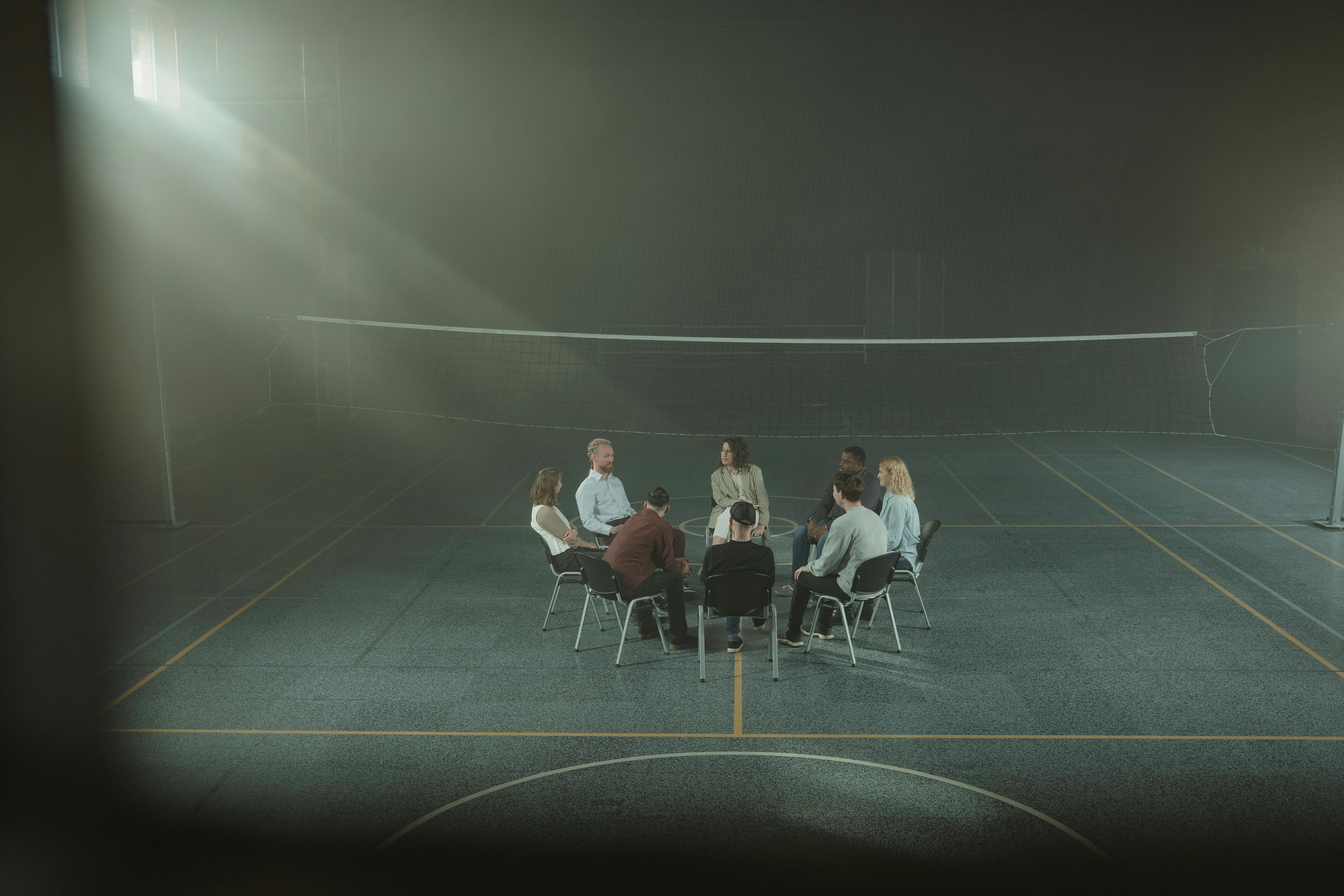 group of people sitting on chair