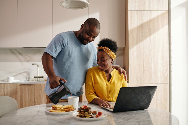 Man Serving Coffee To A Woman