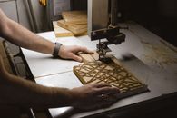 Man working with turning machine and wood