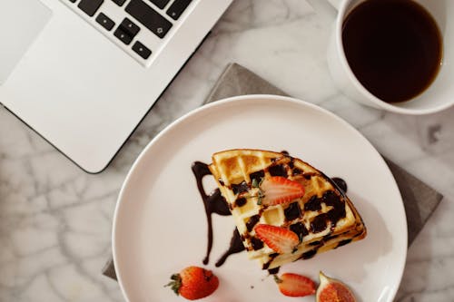 Free Top View of Waffles with Strawberries and Syrup Stock Photo