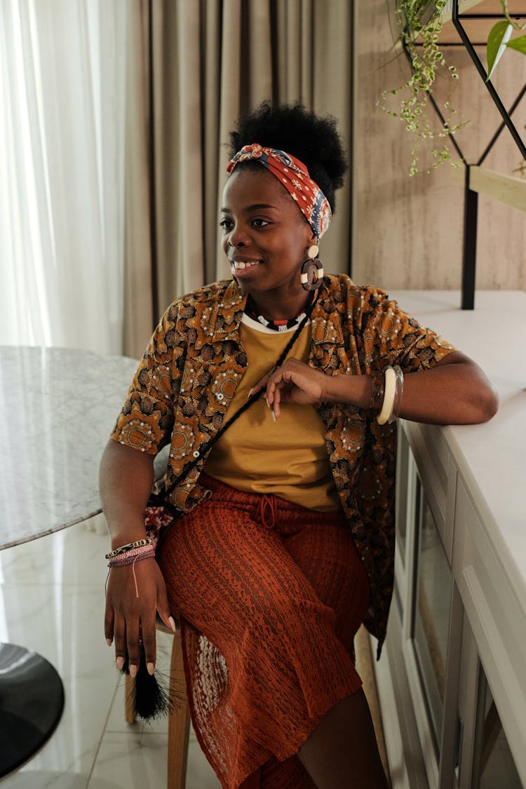 Woman Sitting On A Chair And Looking Sideways