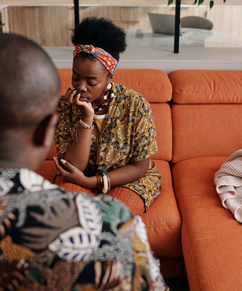 A couple having a calm, focused conversation at home