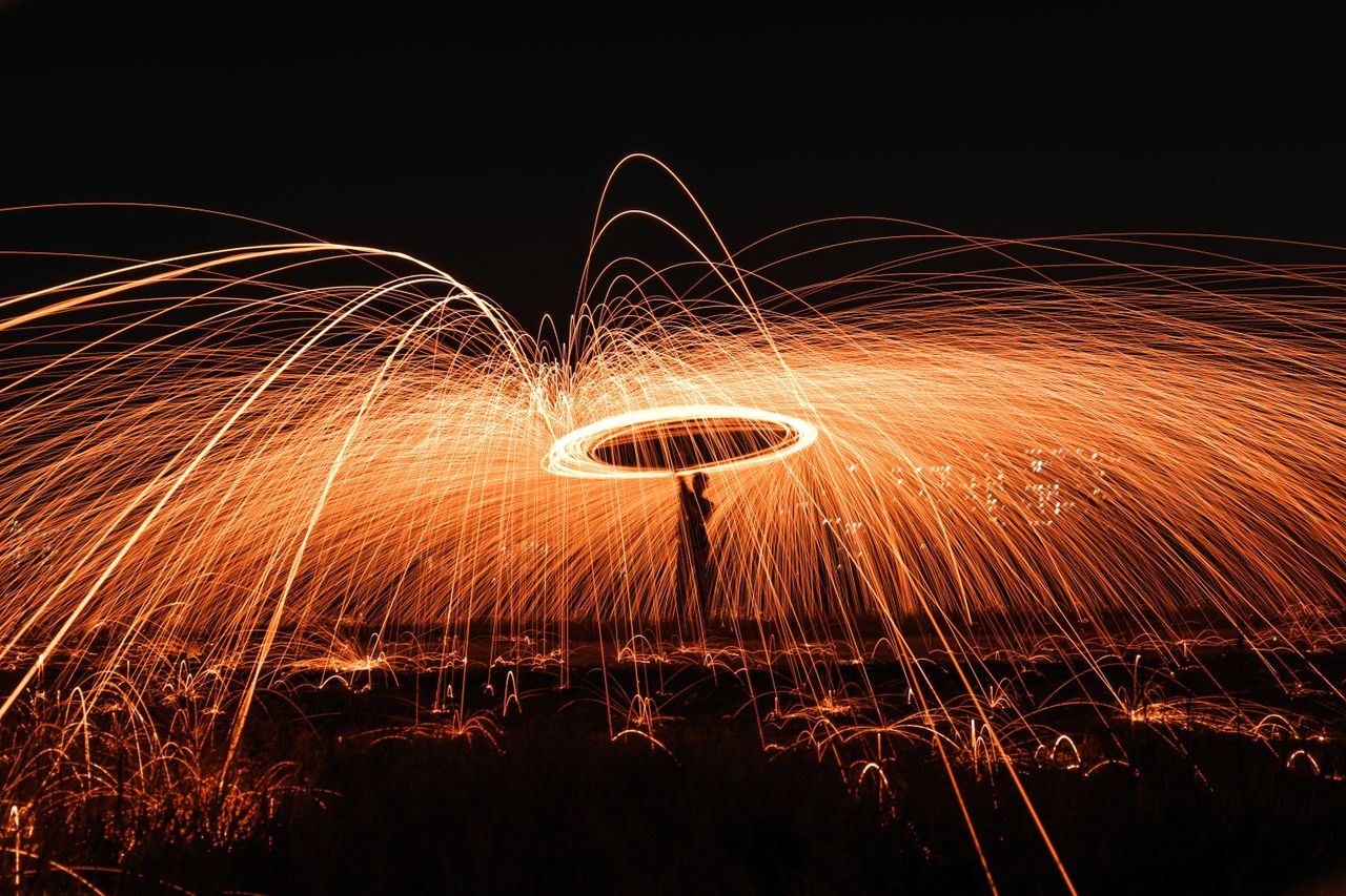 captivating long exposure of steel wool spinning at night creating dyn