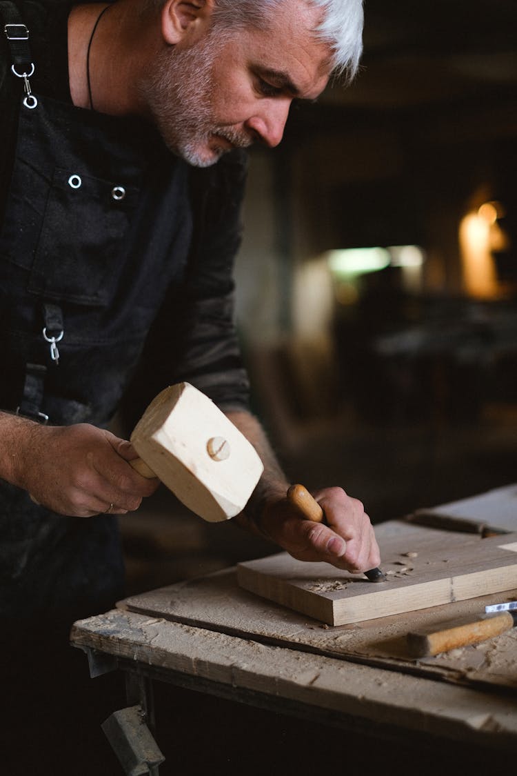 Crop Man With Hammer Carving Wooden Plank