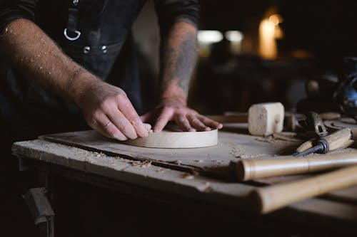 Crop artisan polishing wooden board