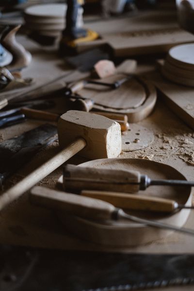 Wood mallet and chisel on a workbench