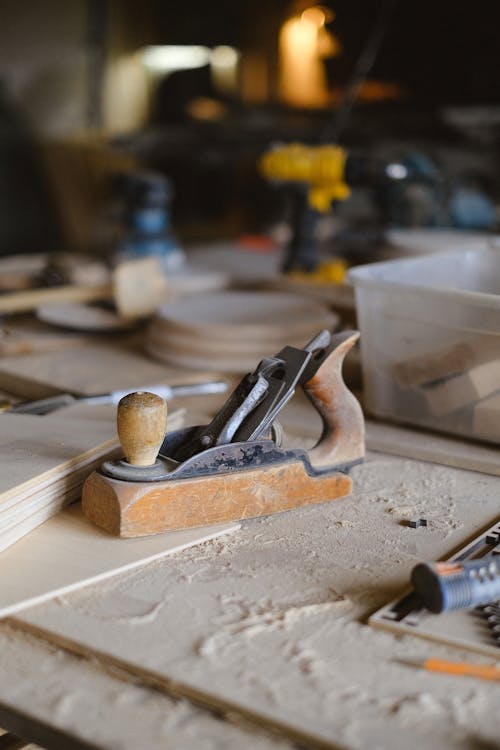 Wooden plank on workbench in workshop