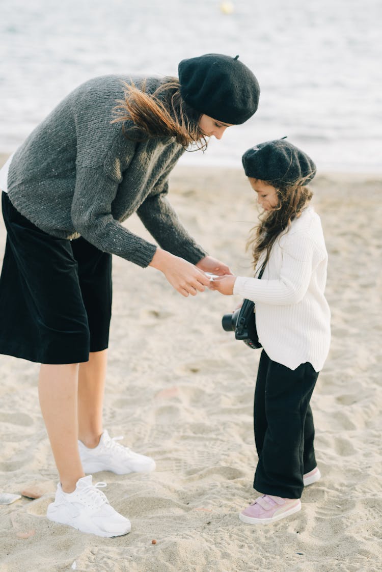 Woman And A Girl At The Beach