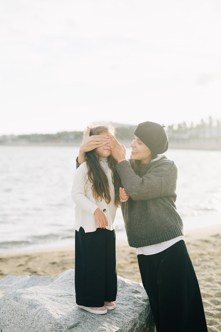 A Mother Covering Daughters Eyes