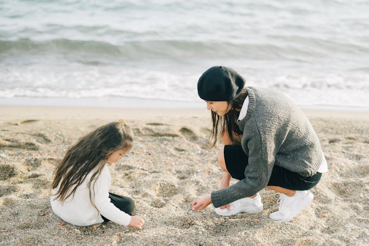 Woman And A Girl At The Beach