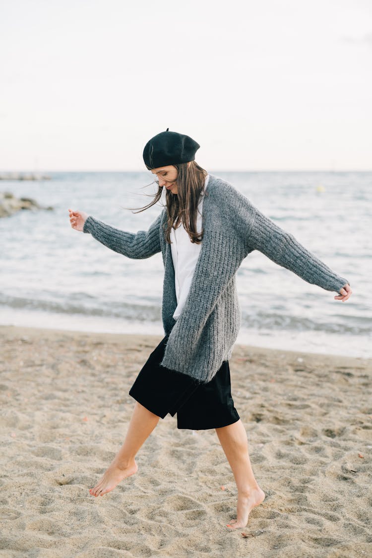 Woman In Gray Cardigan At The Beach