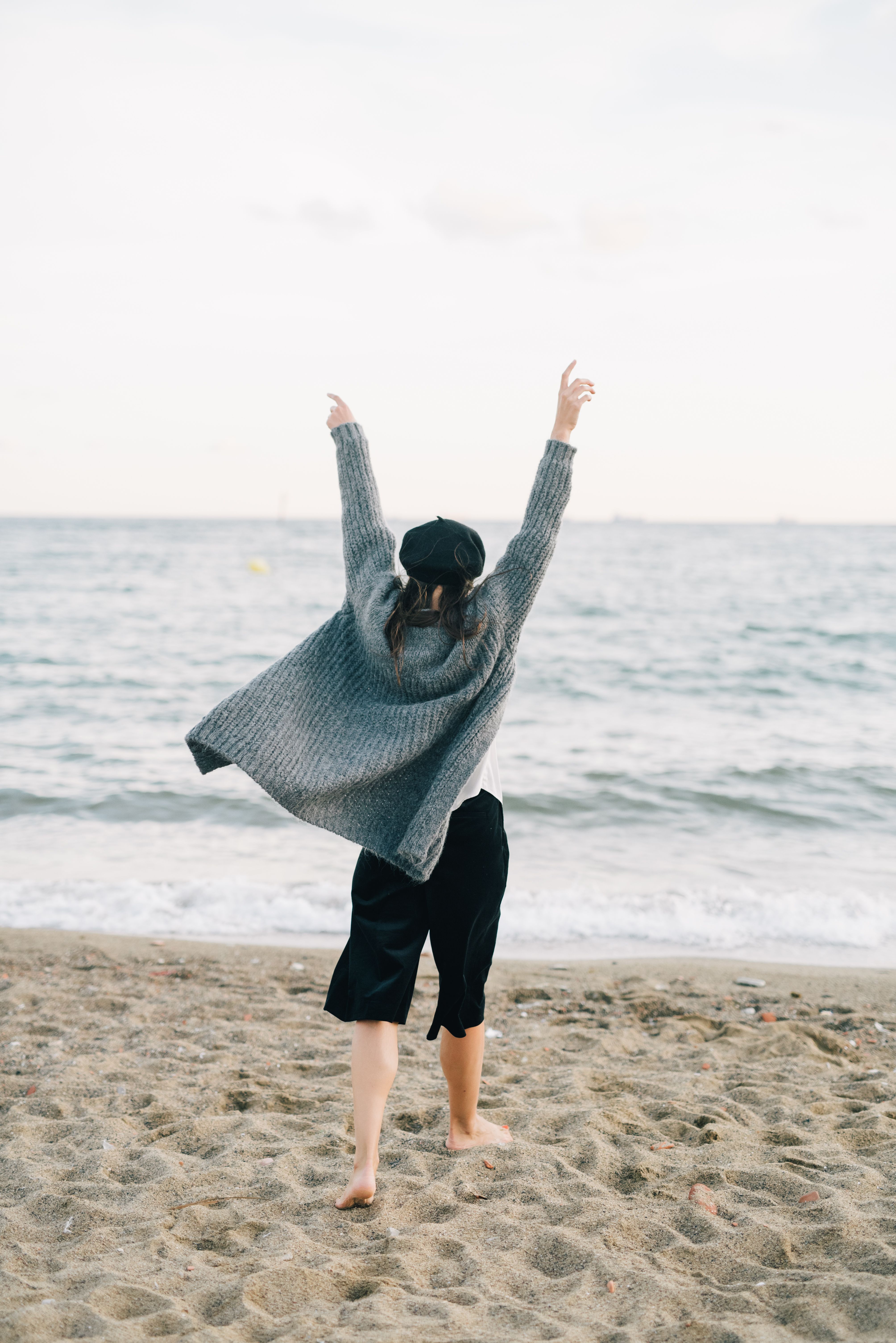 Silhouette of a Person Standing with Arms Outstretched · Free Stock Photo