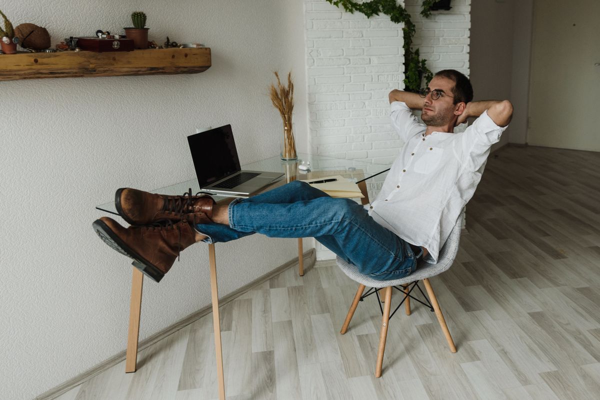 Man working in a home office, illustrating forward head posture from screen time