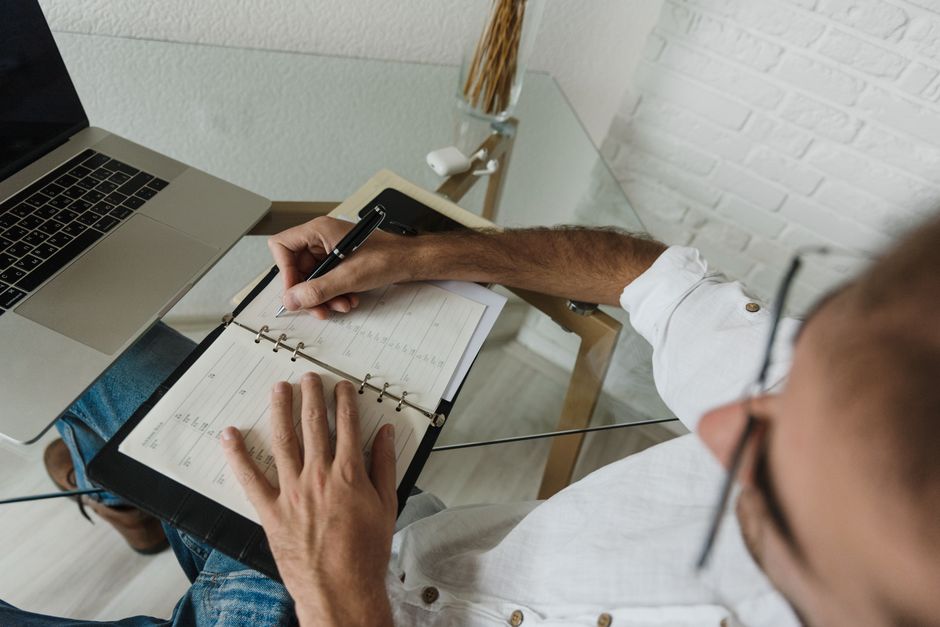 inside a cluttered desktop or notebook setup calendar block desk planning work session lifestyle photo 1