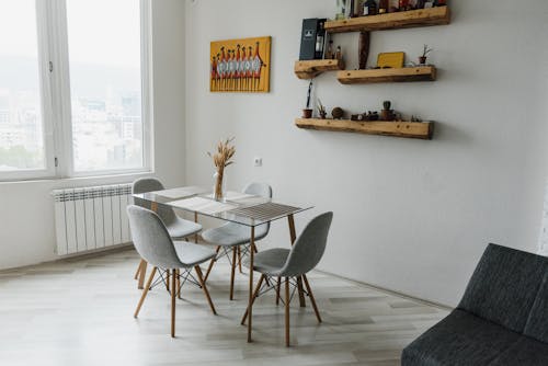 Free Gray Dining Chairs and Glass Table in a Room Stock Photo