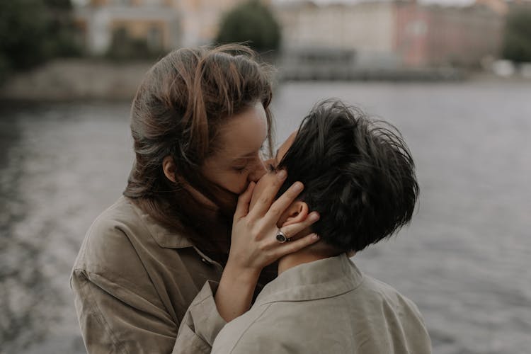 Close Up Photo Of Women Kissing