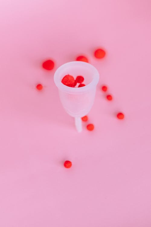 White and Red Heart Shaped Plastic Toy