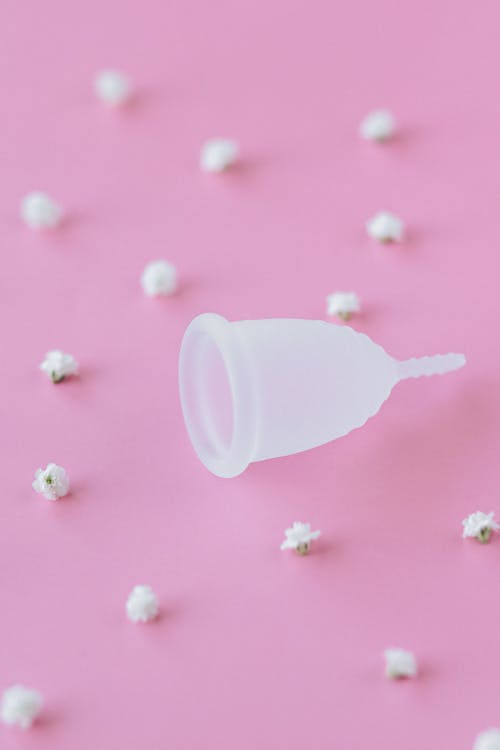 A Menstrual Cup on a Pink Surface