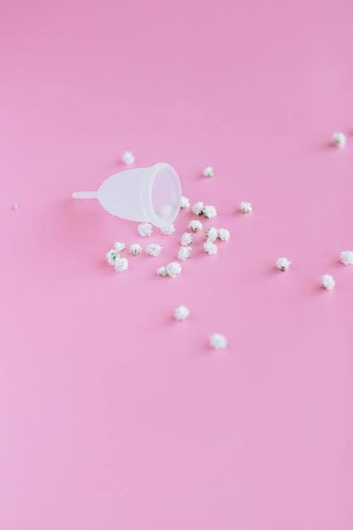 White Ceramic Mug on Pink Surface