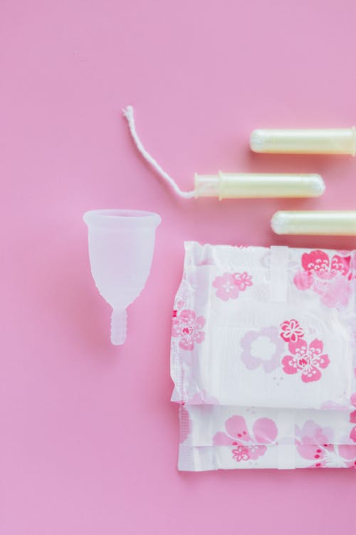 White Plastic Cup With Pink Plastic Spoon
