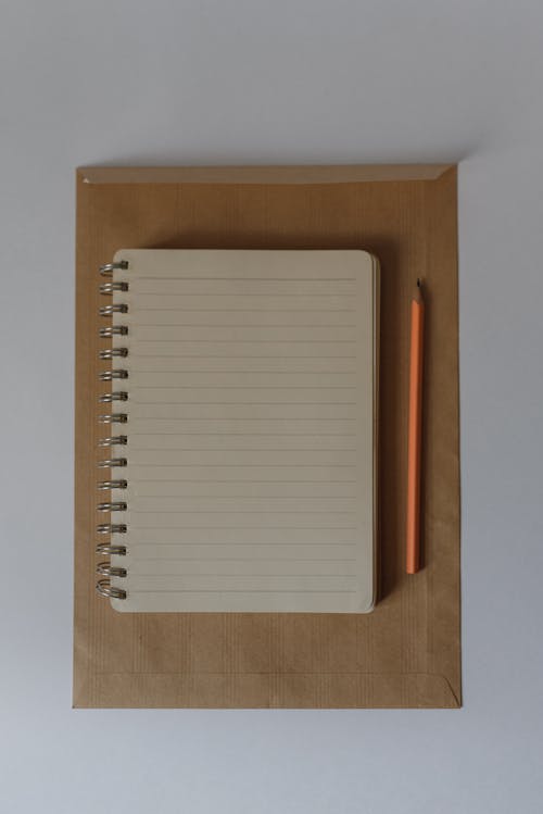 Top View of a Notebook and Pencil