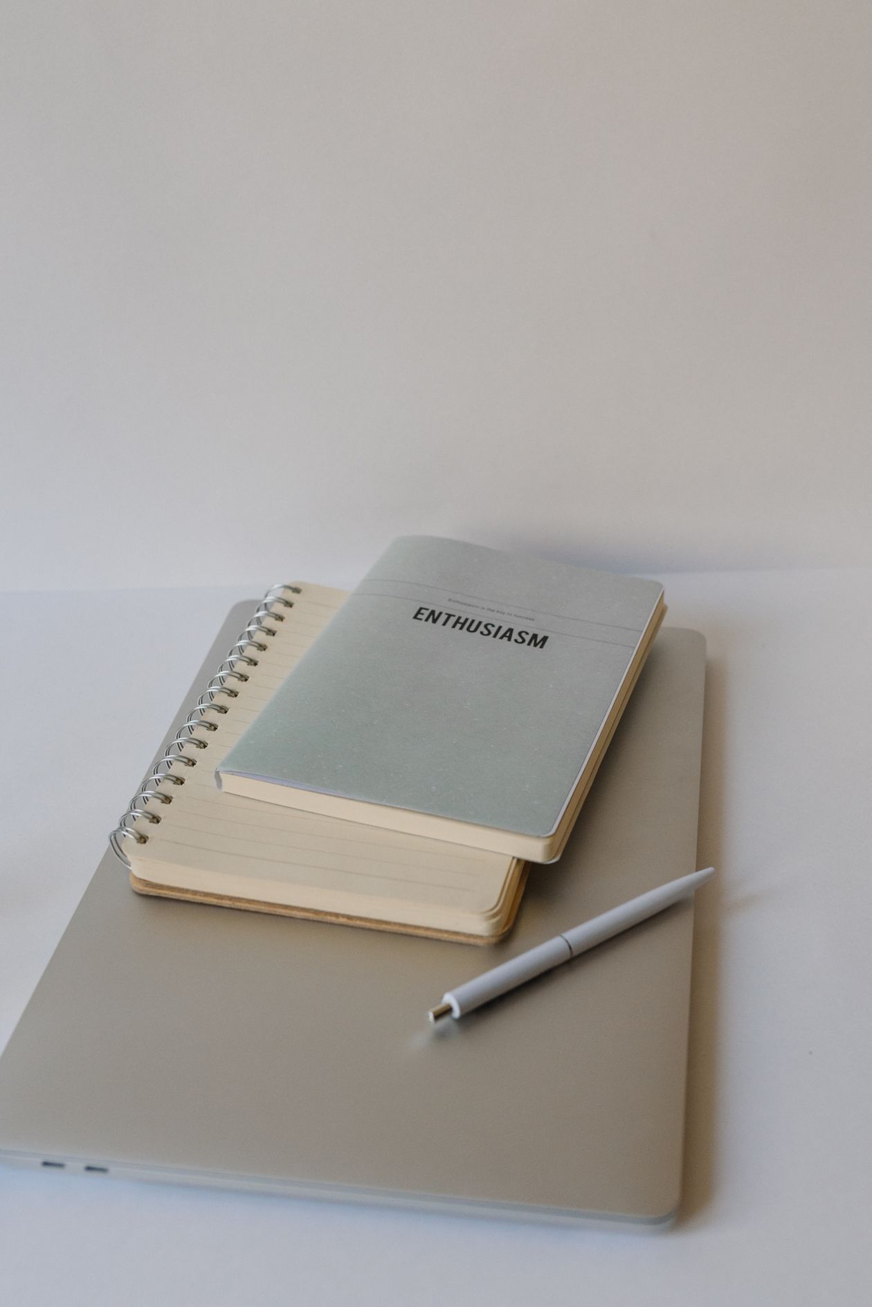 Minimal content planning workspace with notebooks and laptop