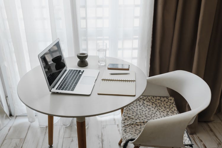  A Laptop On A Table Indoors