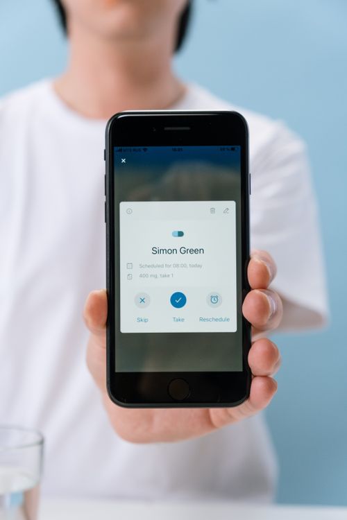 patient using smartphone for healthcare appointment scheduling app
