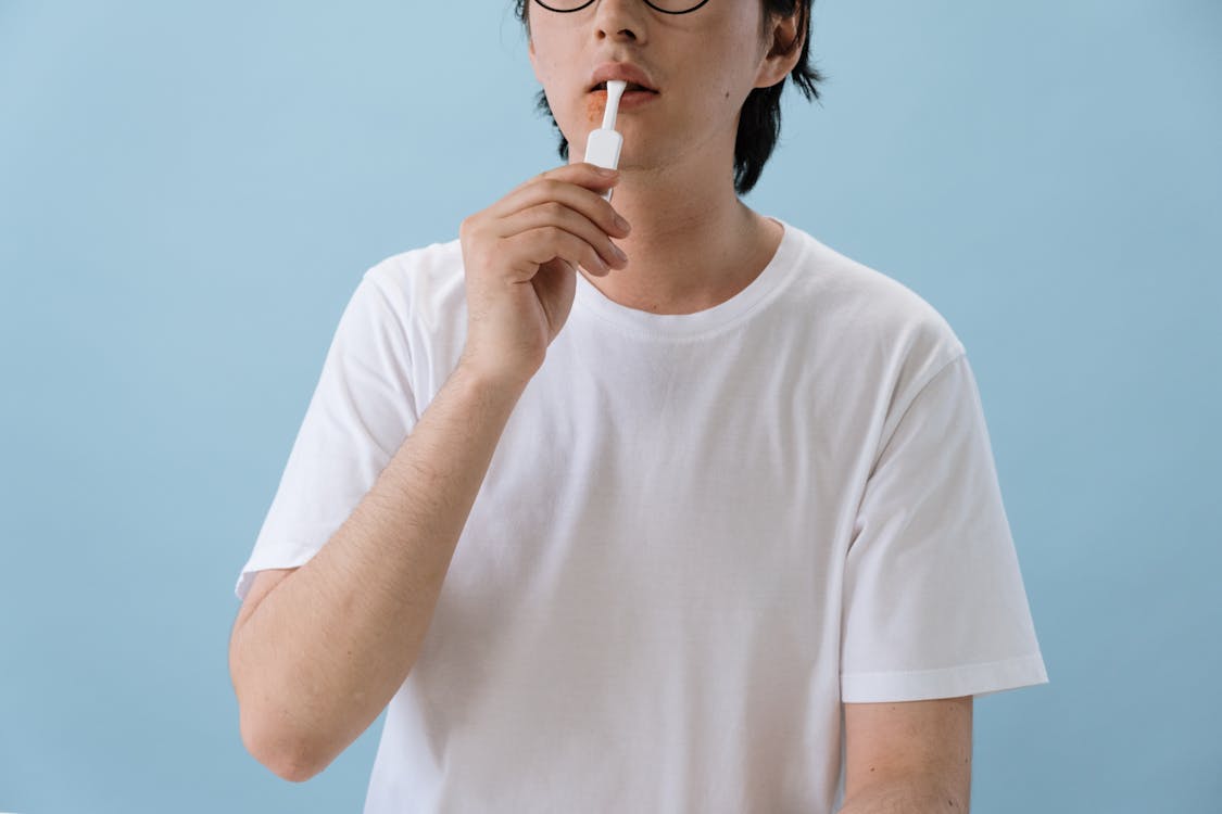 Free Man in White T-shirt Doing HIV Test Stock Photo
