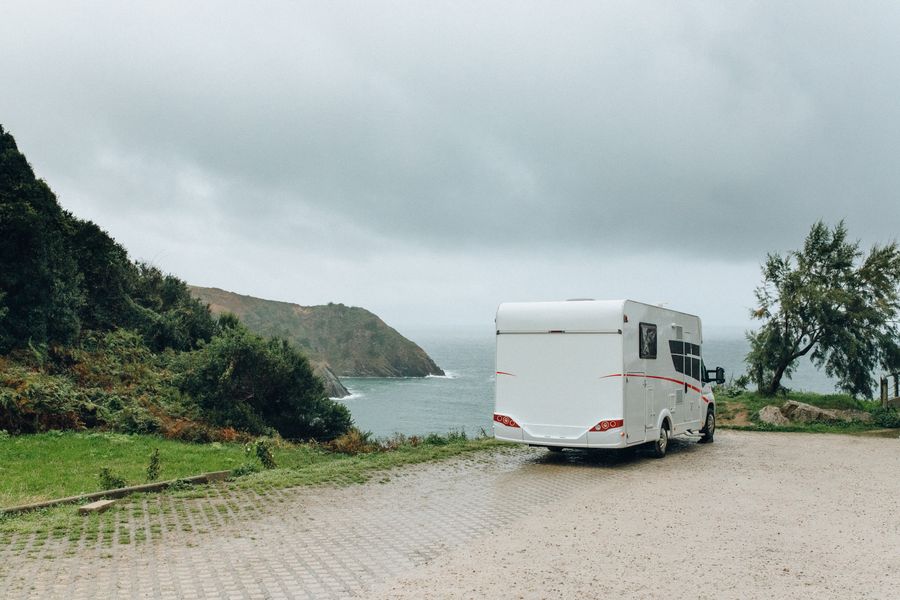 White Mesa Cruiser motorhome parked beside the sea