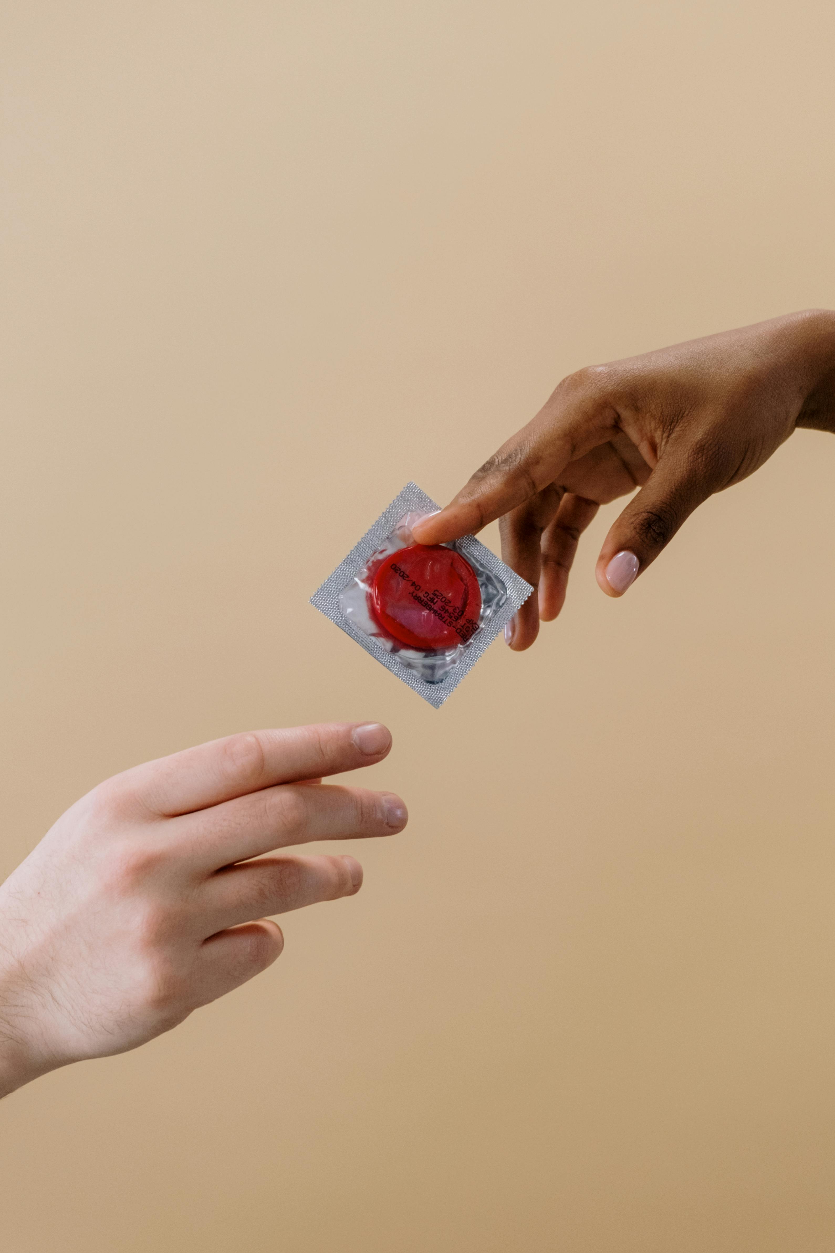 person holding a contraceptive