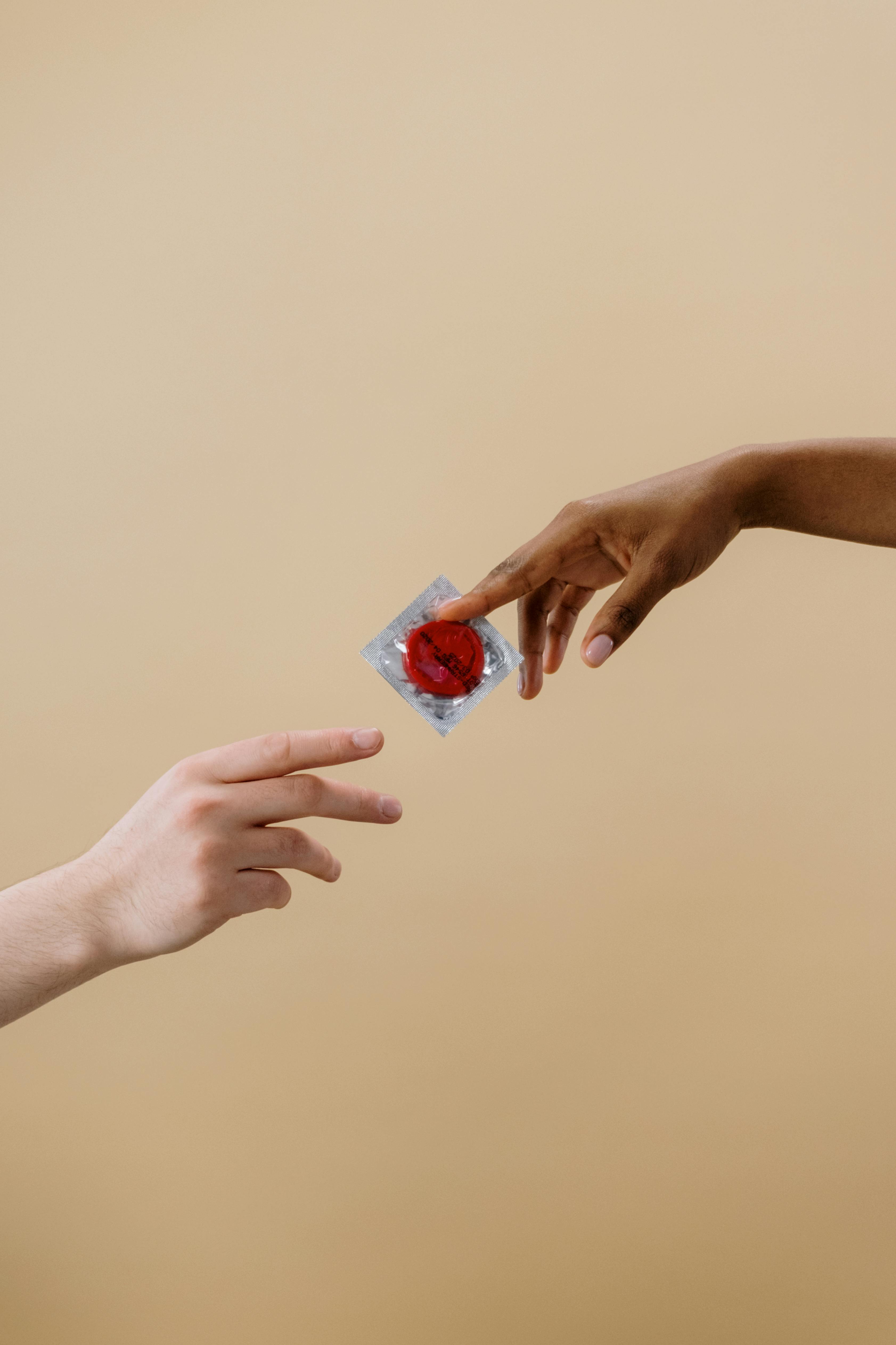 person holding a contraceptive