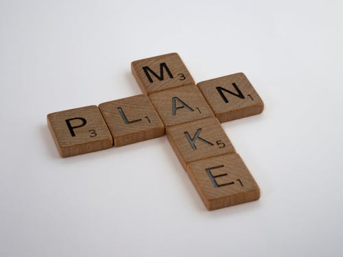 Scrabble Tiles on a White Table