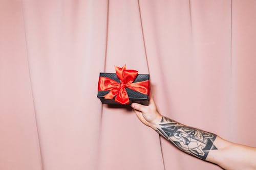 Free Person Holding a Gift Box Stock Photo