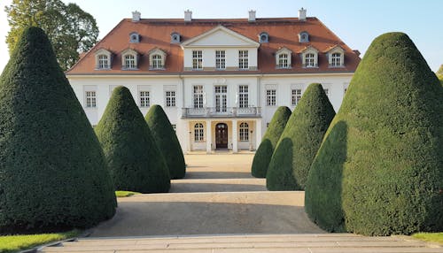 Palace with Trimmed Trees in Garden