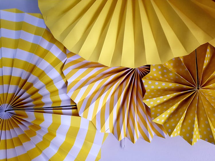 Yellow And White Folded Paper Decorations