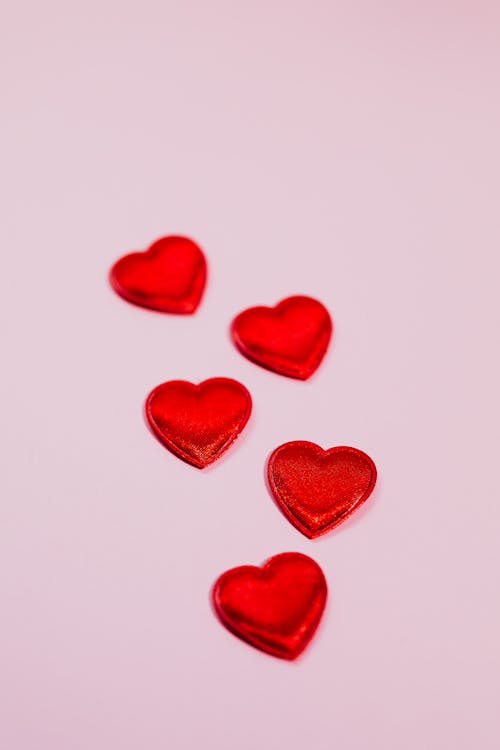 A Red Heart Shape on a Pink Surface