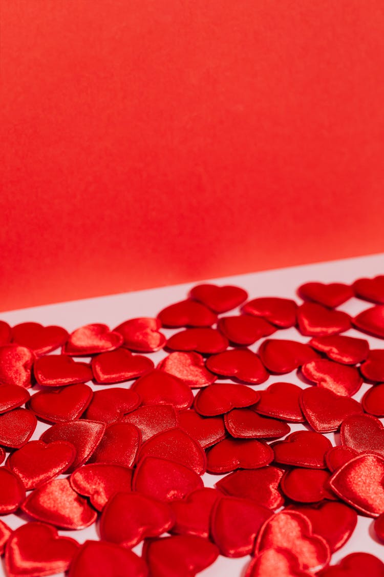 Red Heart Shaped Patches On Pink Surface