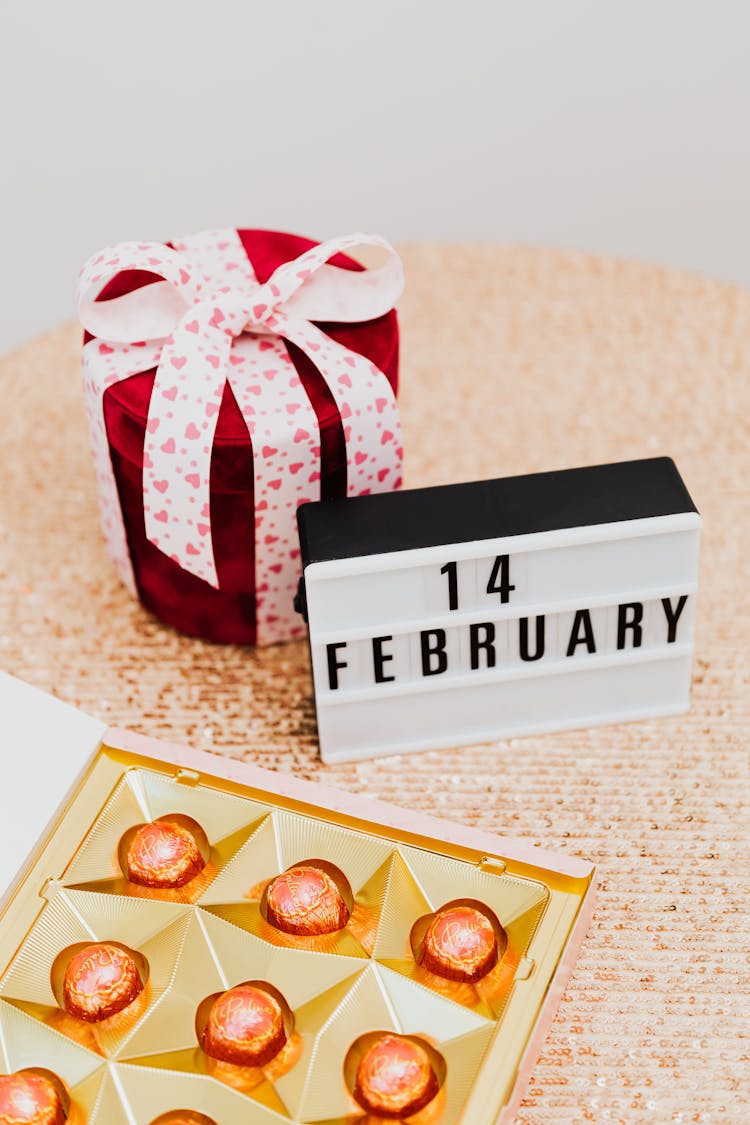 Chocolates And Valentines Day Gift On Table