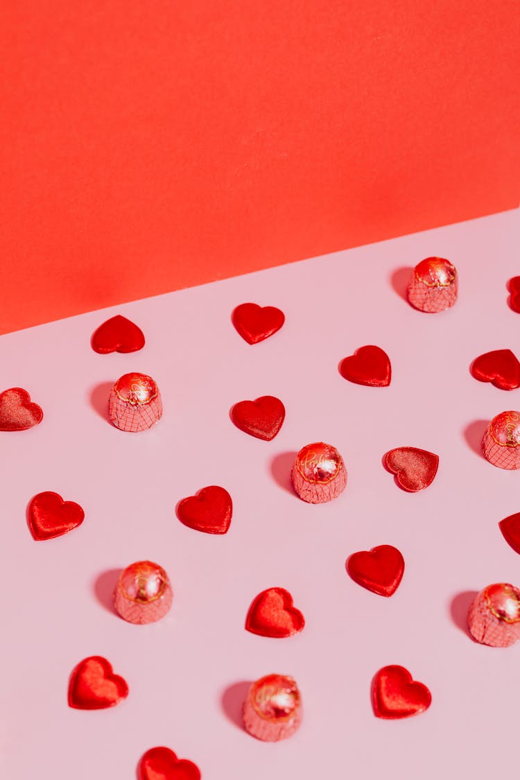 Red Hearts And Sweets Decoration On Studio Background