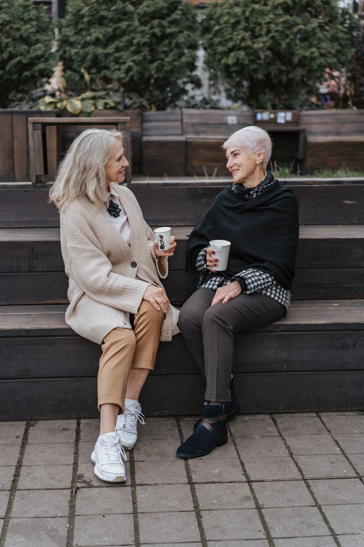 Elderly Women Talking While Drinking Coffee