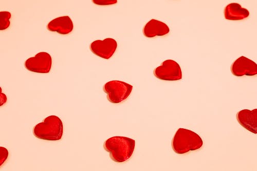 Free Heart Shaped Candies on a Pink Background  Stock Photo