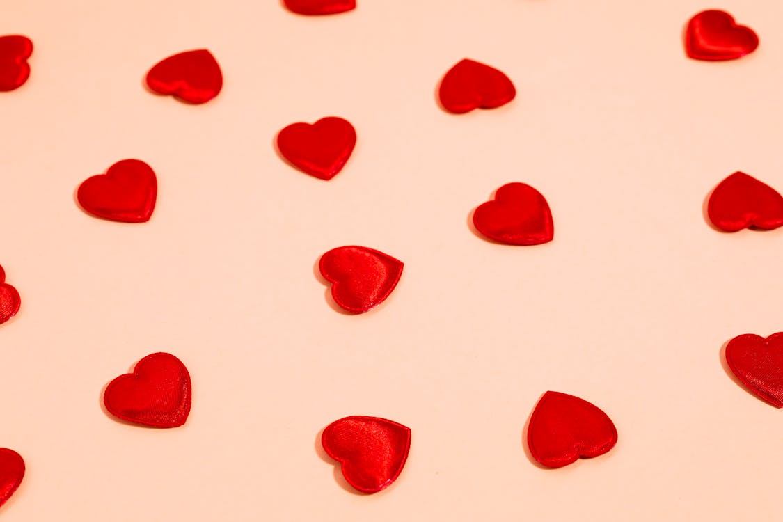 Heart Shaped Candies on a Pink Background 